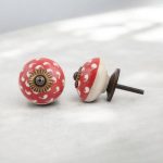 Red and white ceramic cabinet knob