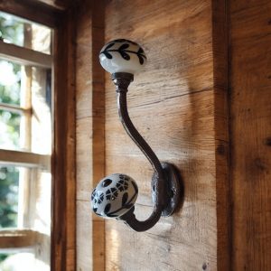 decorative ceramic hook with black and white knobs