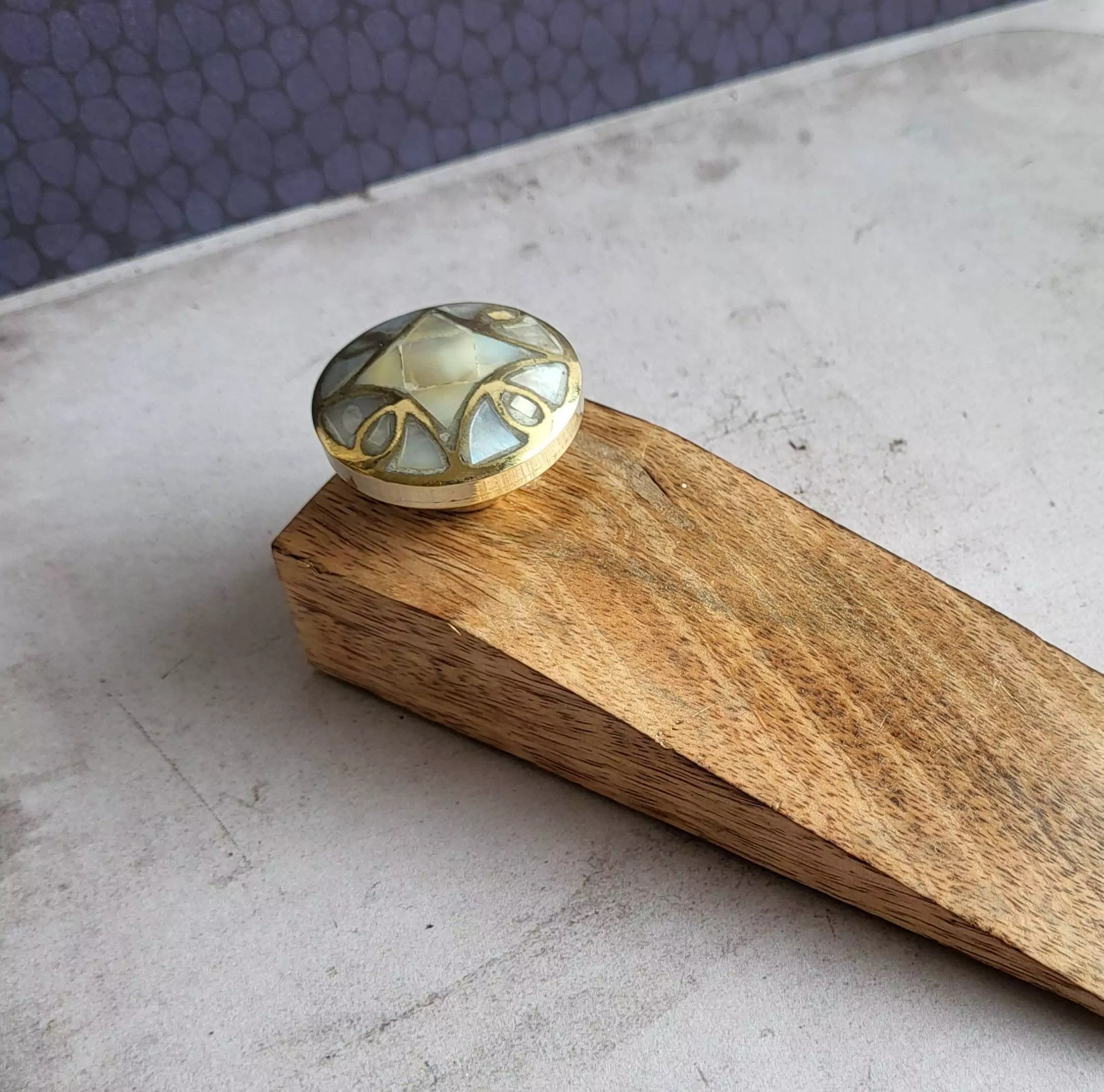 The Brass Divine Wedge