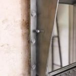 rustic industrial metal mirror with hooks